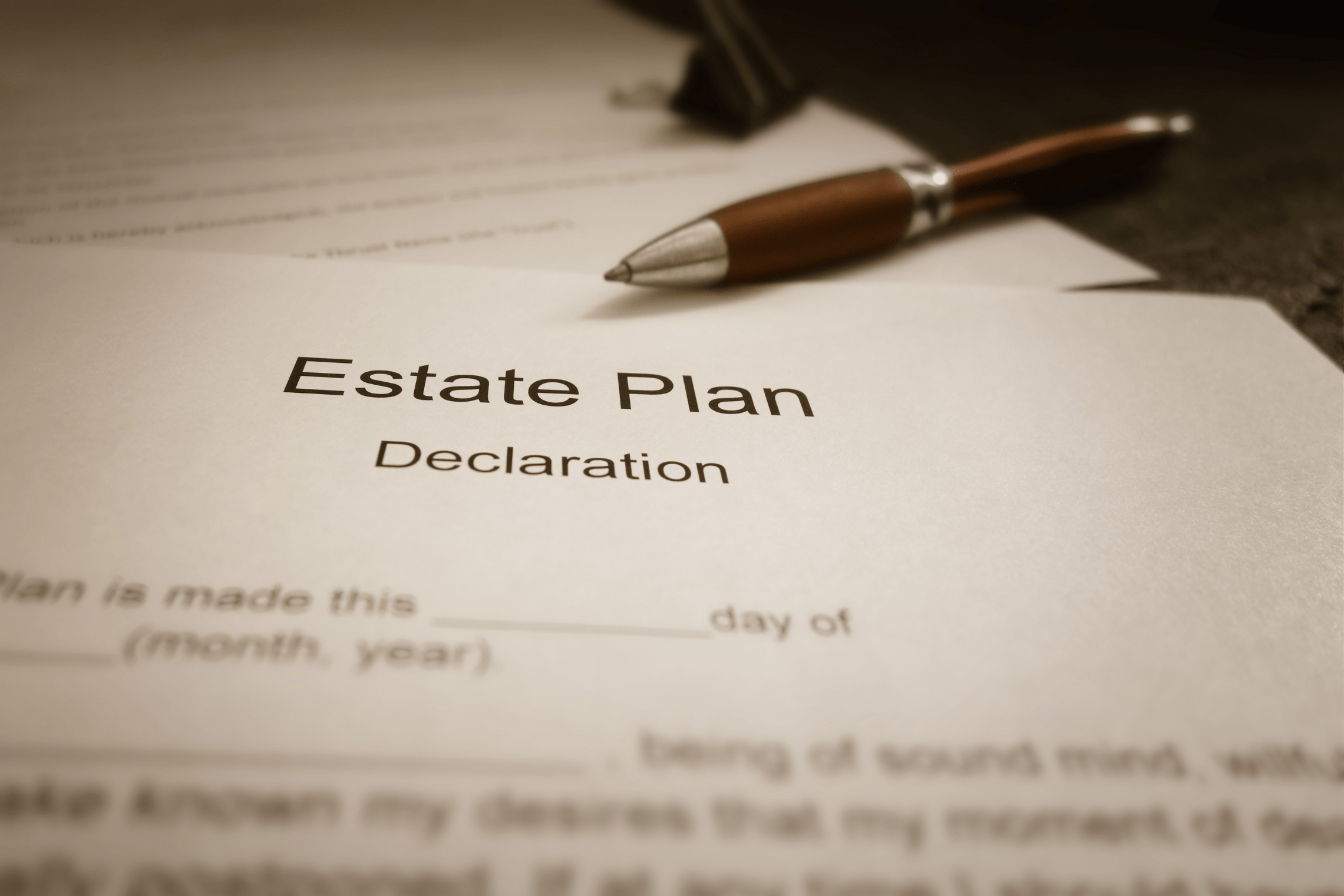An image of estate planning documents with a pen.