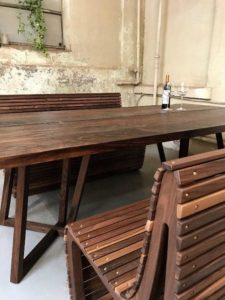 An image of a wooden table and benches